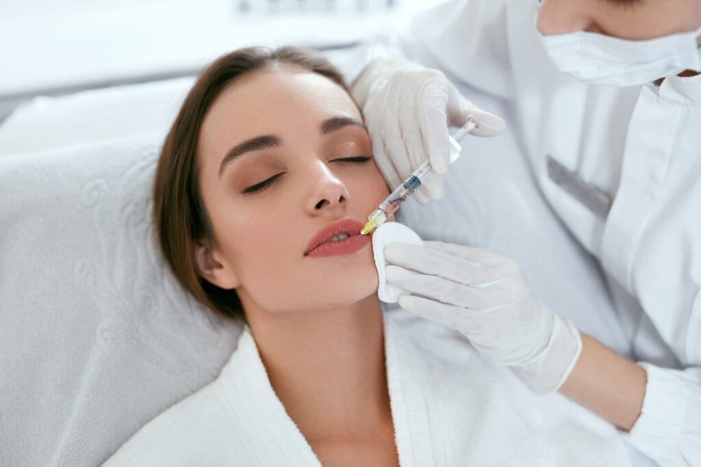Lip filler treatment being performed step by step at an Oakville clinic