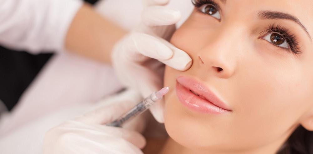 Advanced aesthetic nurse injector performing a dermal filler treatment at Oakville Flawless Cosmetic