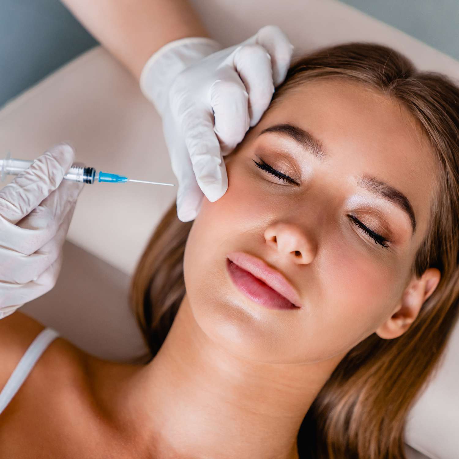 Cheek filler treatment being performed step by step at an Oakville clinic