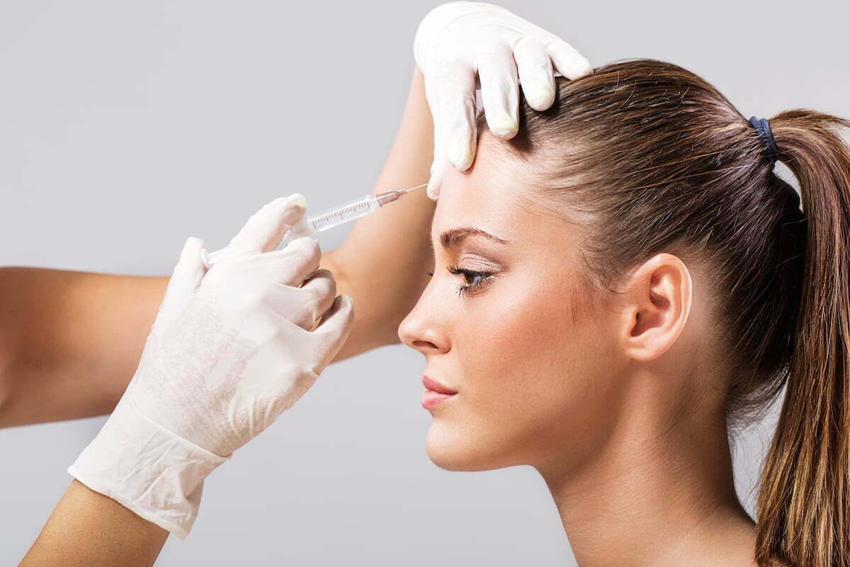 Provider discussing Botox candidacy with a client in Oakville