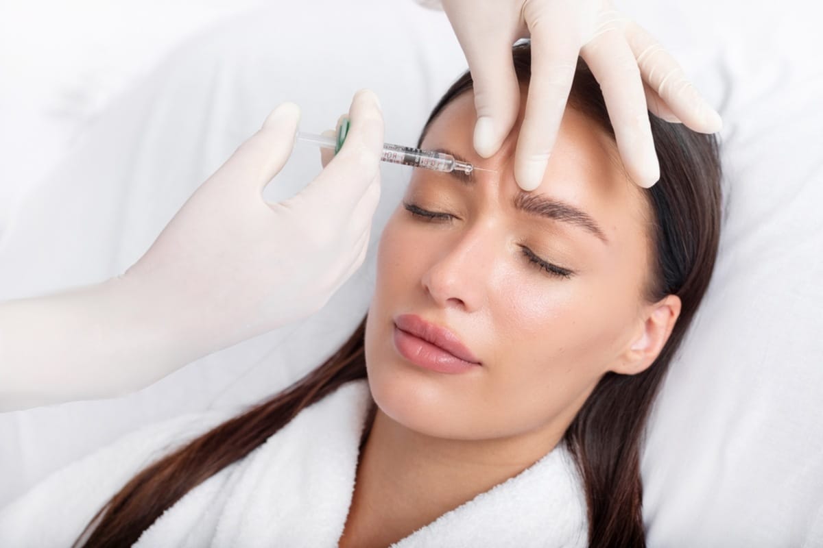 Woman receiving a Botox injection to the forehead at an Oakville clinic