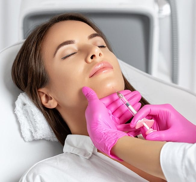 Advanced aesthetic nurse injector performing chin filler at Oakville Flawless Cosmetic