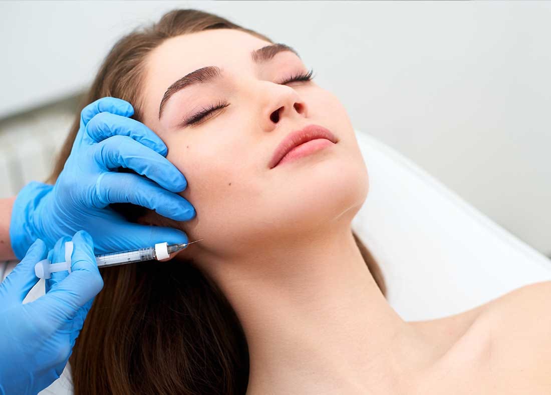 Close-up of natural-looking jawline filler results and a defined lower face in Oakville