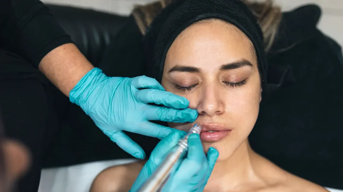 Advanced aesthetic nurse injector performing lip filler at Oakville Flawless Cosmetic