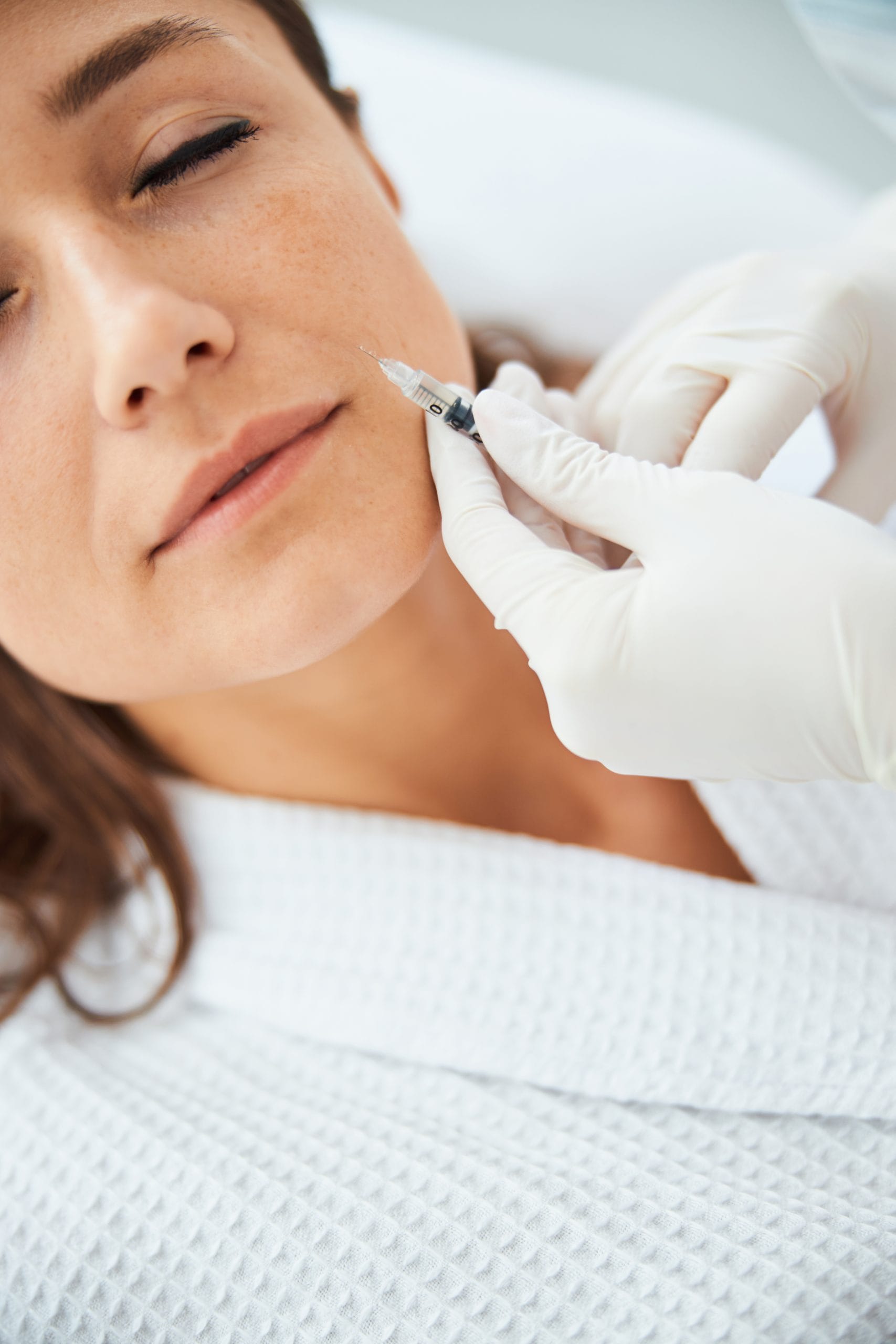 Advanced aesthetic nurse injector performing marionette line filler at Oakville Flawless Cosmetic