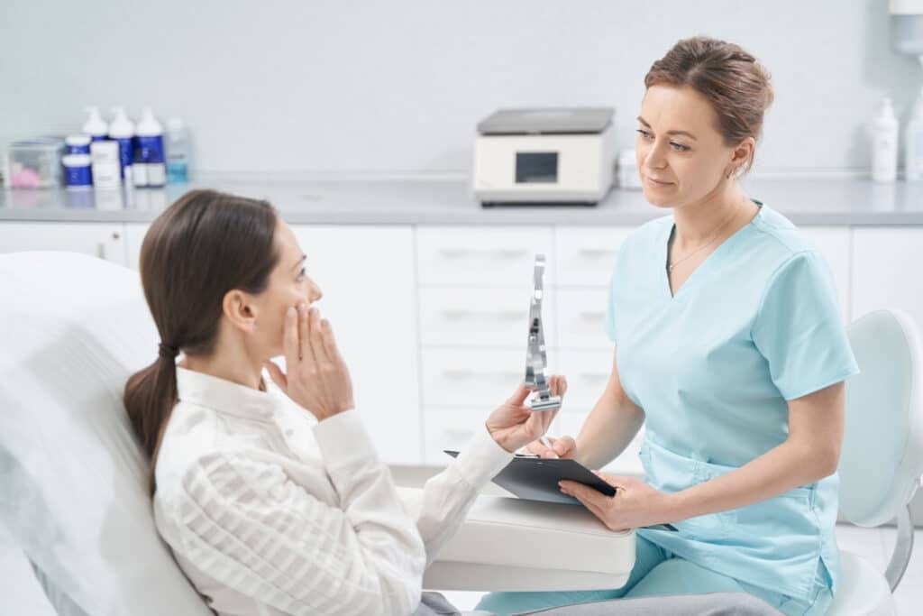 Provider discussing dermal filler candidacy with a client in Oakville