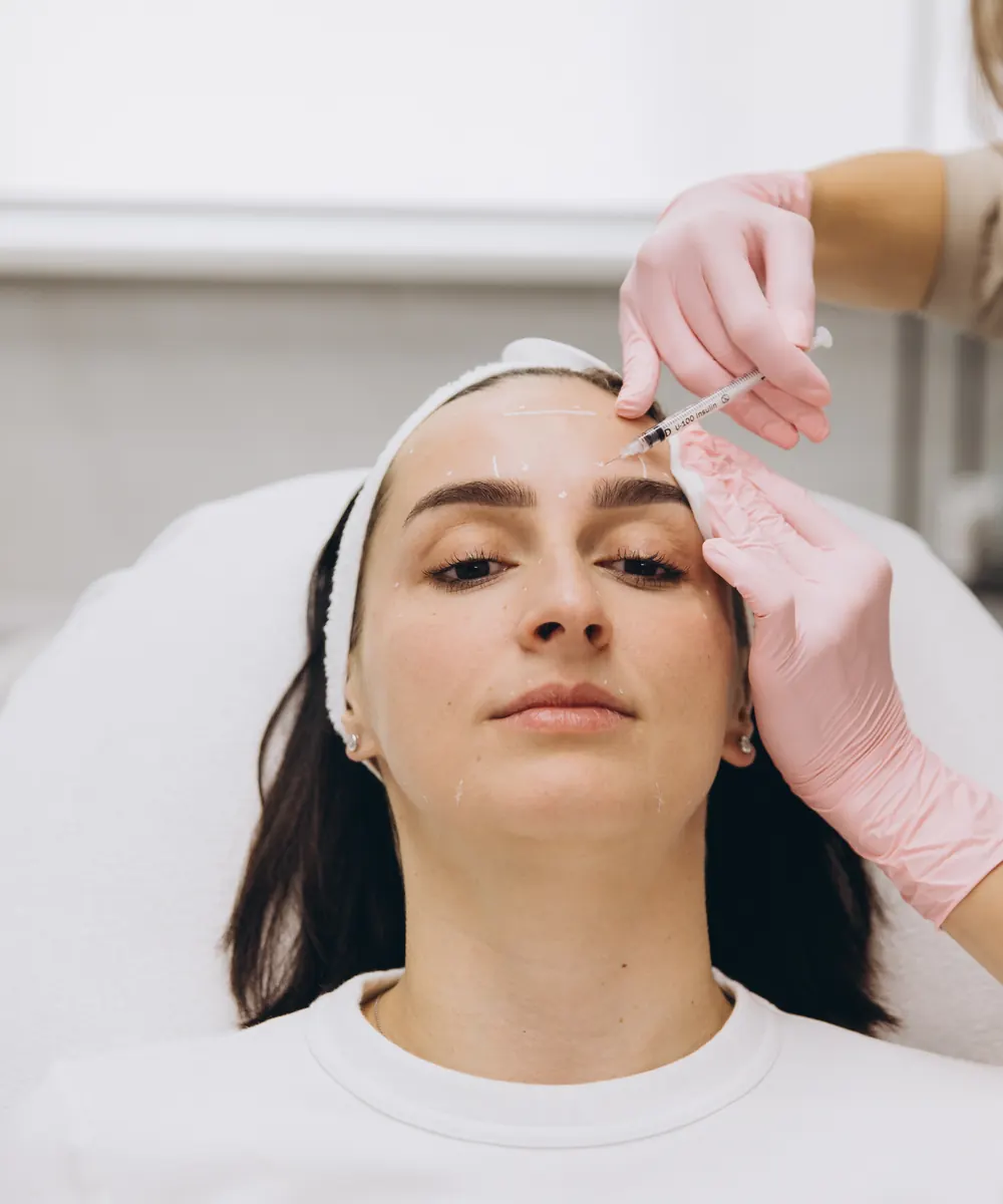 Frown line treatment being performed at an Oakville clinic