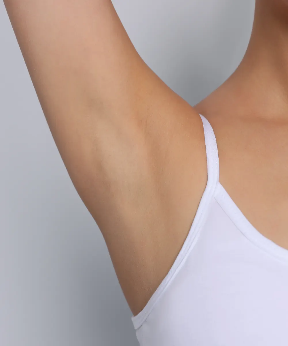 Woman with a raised arm, comfortable and confident