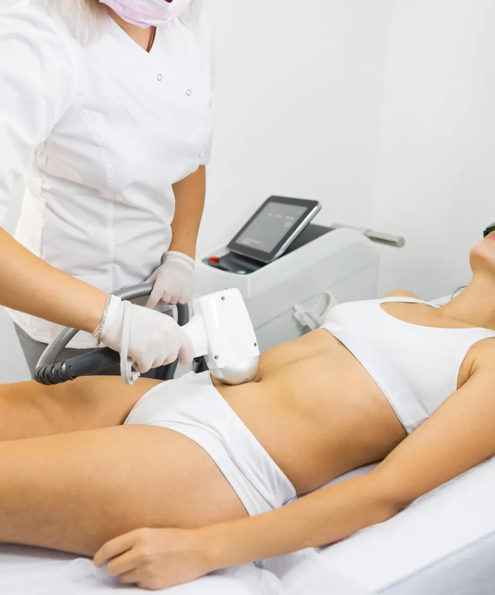 Laser hair removal being carried out on a draped patient at a medical spa