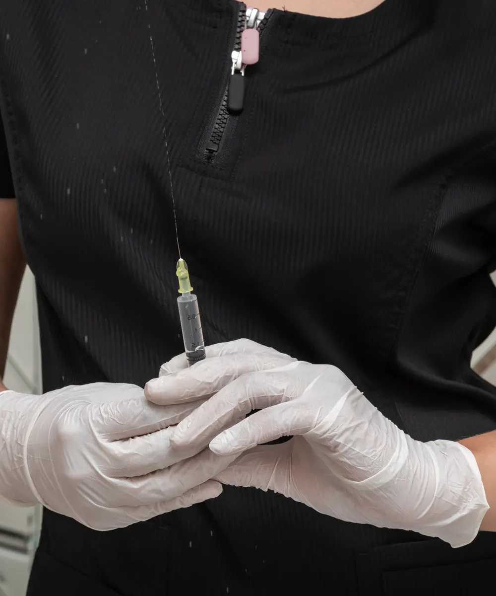 Aesthetic nurse injector preparing a neuromodulator treatment at an Oakville clinic