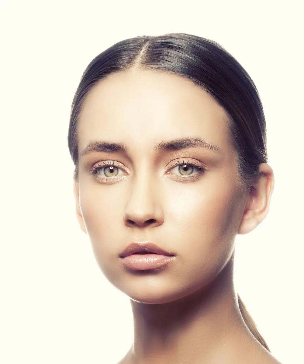 Woman with a slim, well-defined lower face and jawline