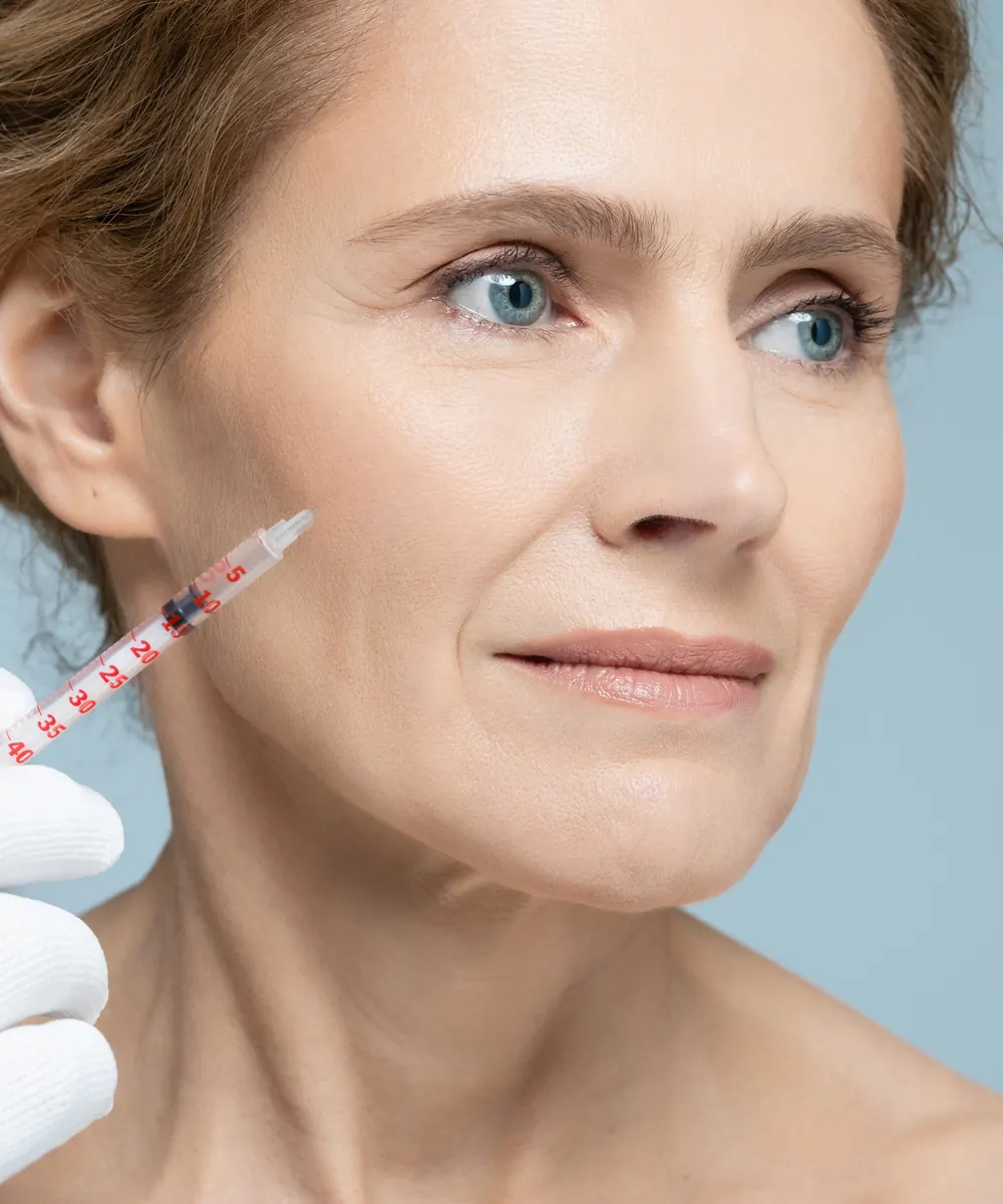 Aesthetic nurse injector talking with a patient during a consultation at an Oakville clinic