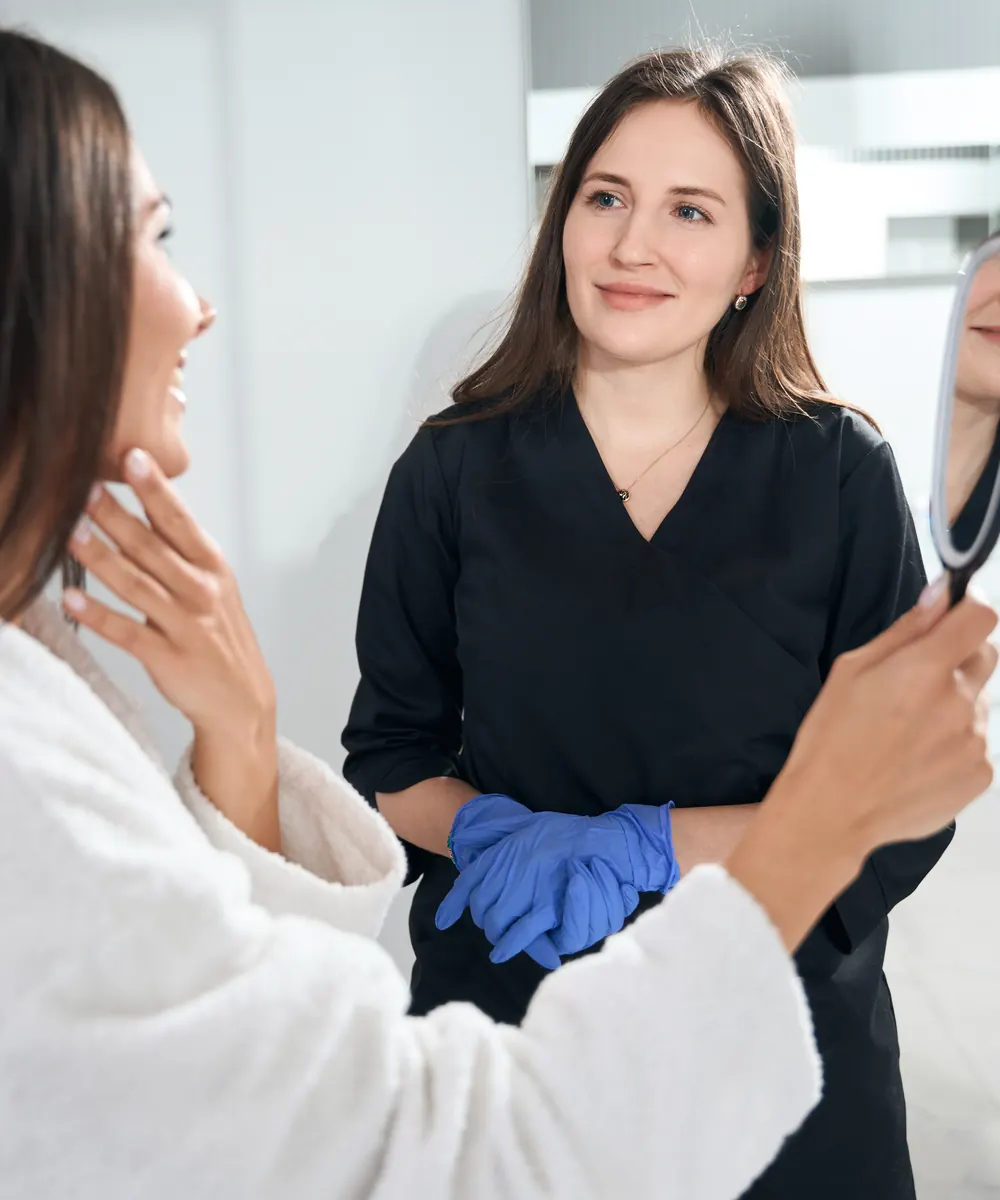 Close view of a woman's lower face and chin during an aesthetic assessment