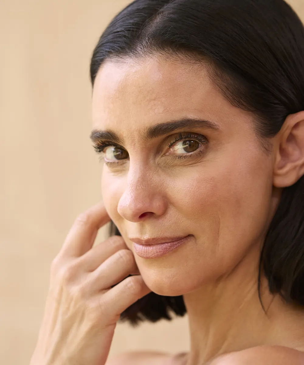 Close up of a woman's face showing smooth, well hydrated skin texture