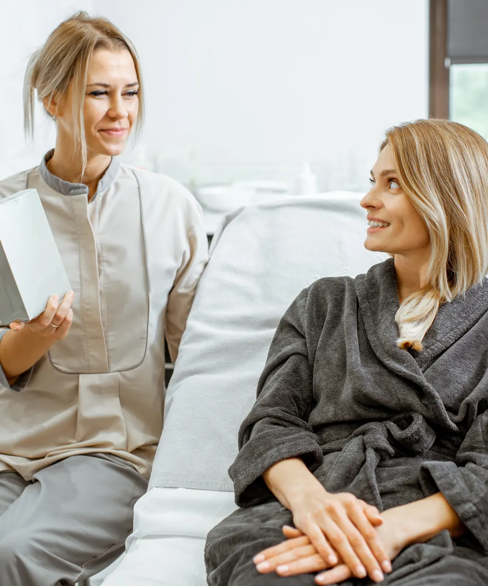 Nurse injector and patient discussing a treatment plan during a consultation