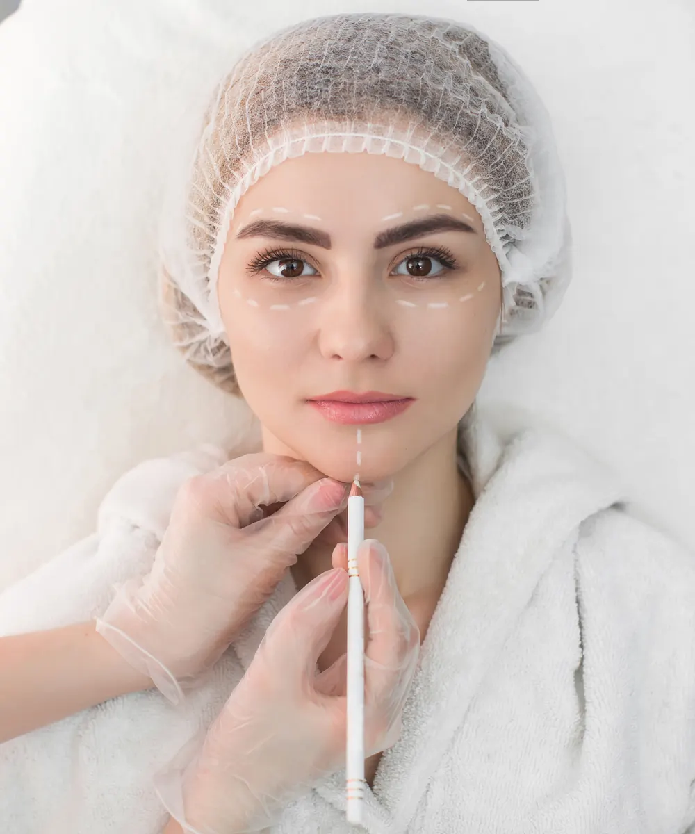 Patient having a cosmetic thread procedure carried out in a bright medical clinic