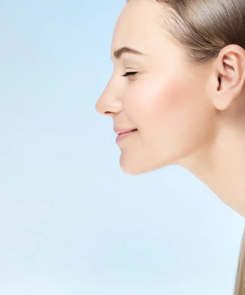 Profile view of a woman with a defined, natural looking nasal contour